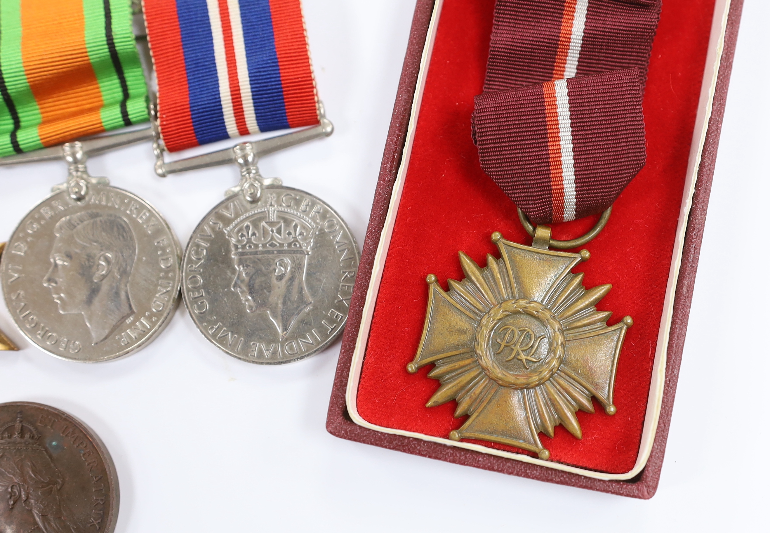A WWII medal group comprising The Burma Star, The 1939-1945 Star, The Defence medal and The War medal, a cased 1870 Republique Francaise medal, a Victoria Golden Jubilee medallion, an 1855 Napoleon medallion, a Polish Cr